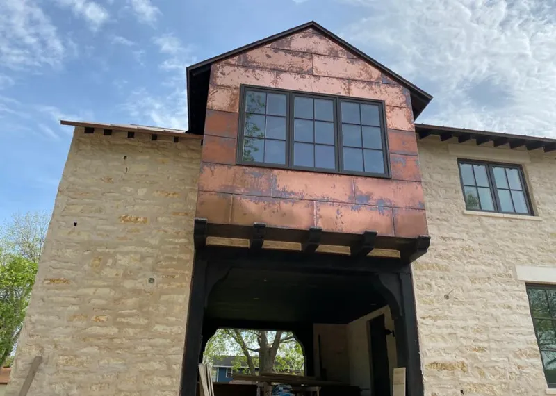 Copper metal panel facade on a stone building for Metal Roof Coating in Red Hill