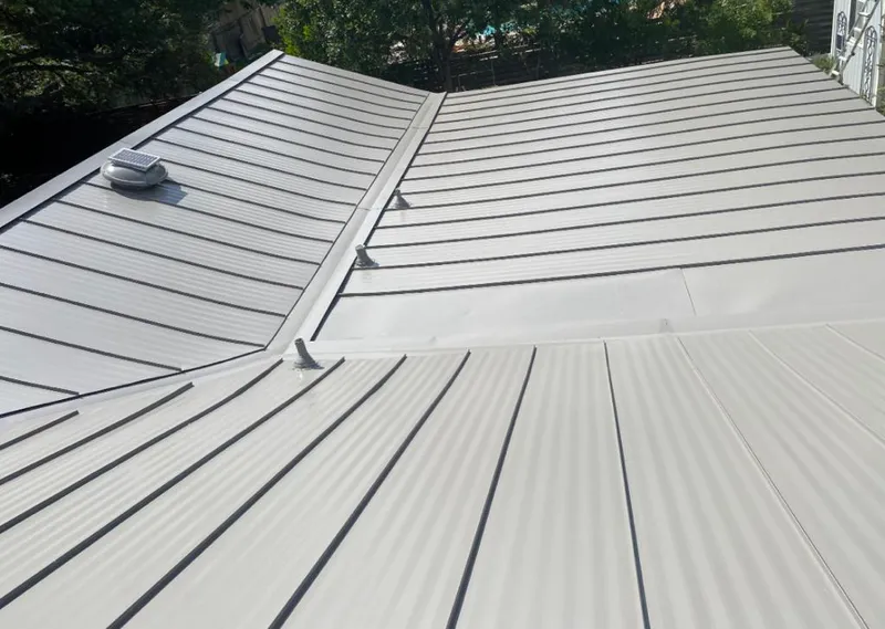 Solar attic fan installed on a metal roof for Roof Ventilation in Red Hill